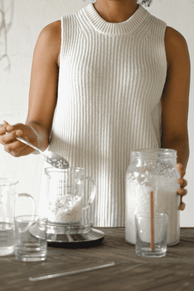 woman preparing waxing mix